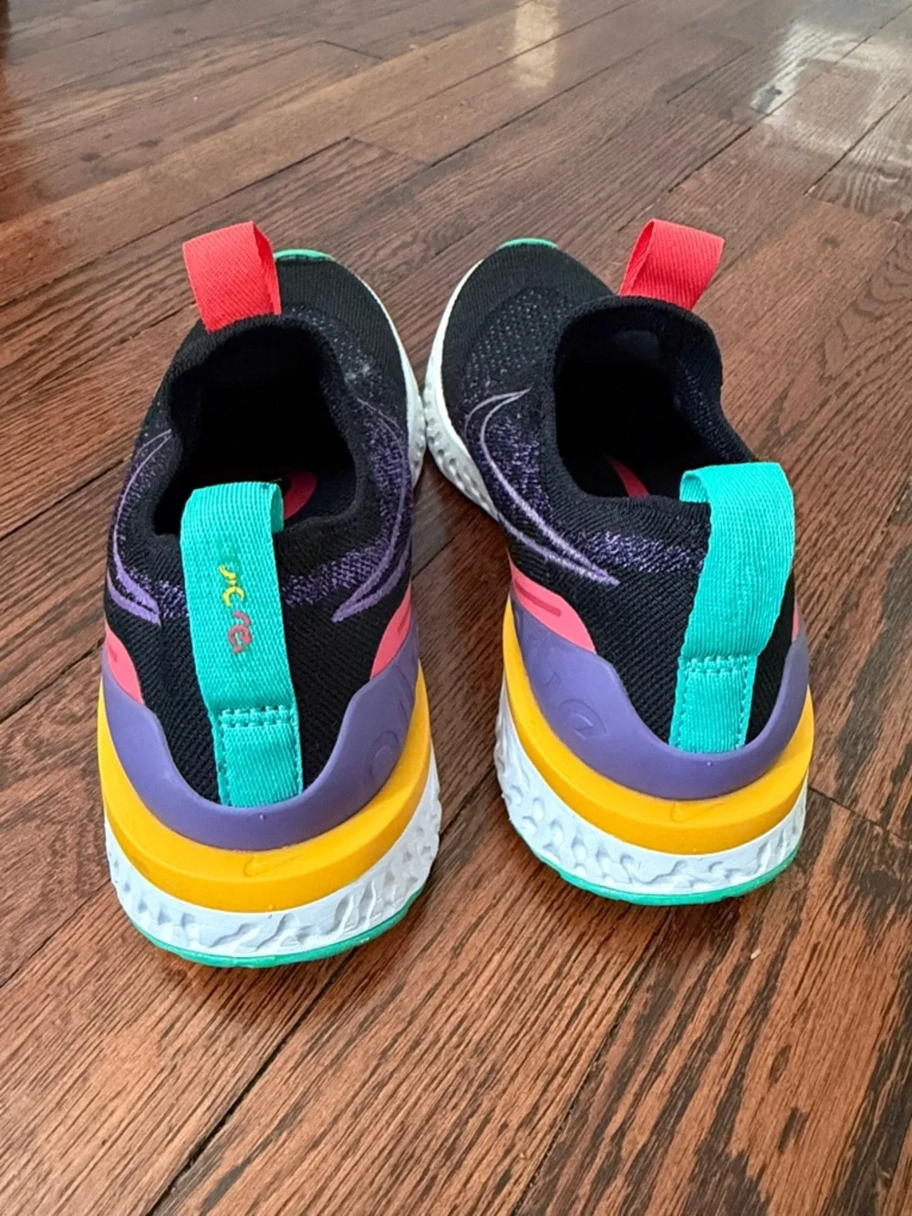 Nike Women's Black Athletic Slip-On Shoes with Purple, Teal & Yellow Accents